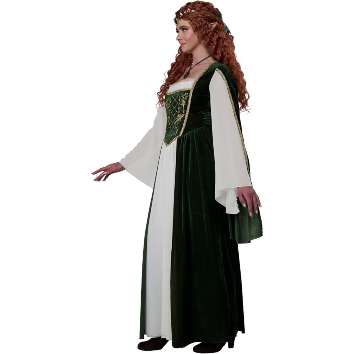 A woman modeling a medieval-style costume dress with a dark green velvet tunic, white long sleeves, and a green panel with gold embroidery on the chest, against a plain white background.