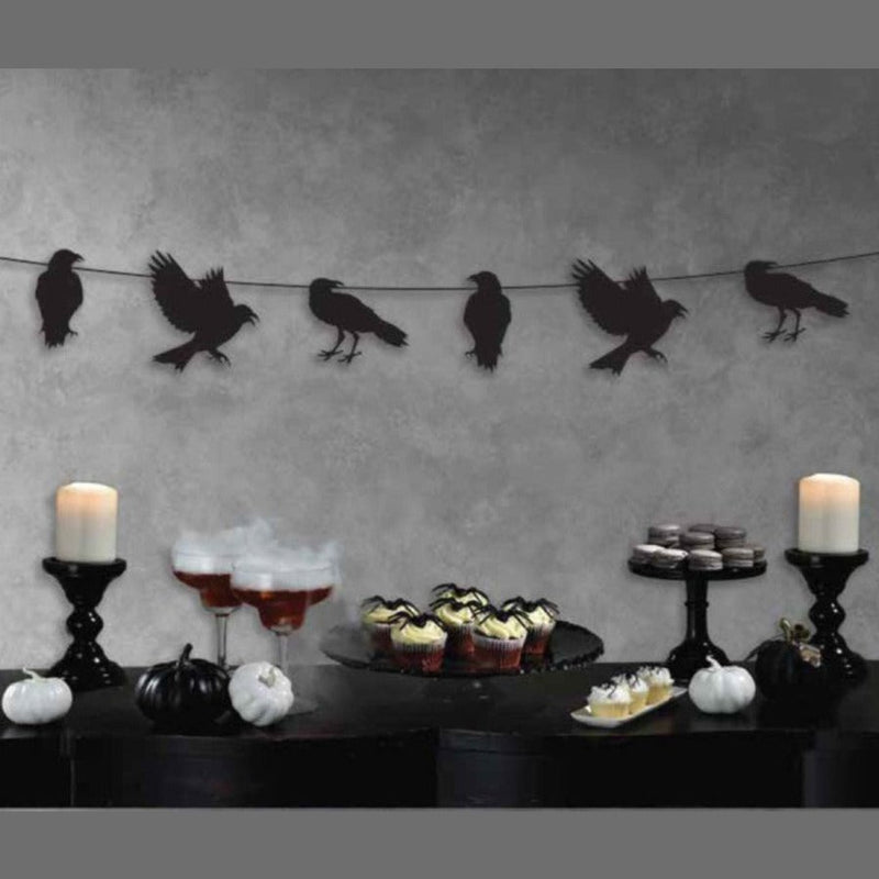 Colorful crow bunting string banner Halloween decoration hanging outdoors