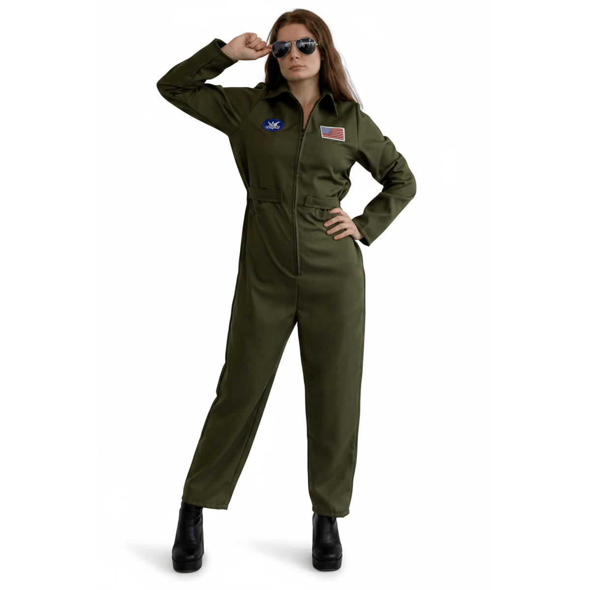 A woman modeling an olive green military-style jumpsuit with a zip front, long sleeves, and small embroidered patches on the chest, posed against a plain white background.