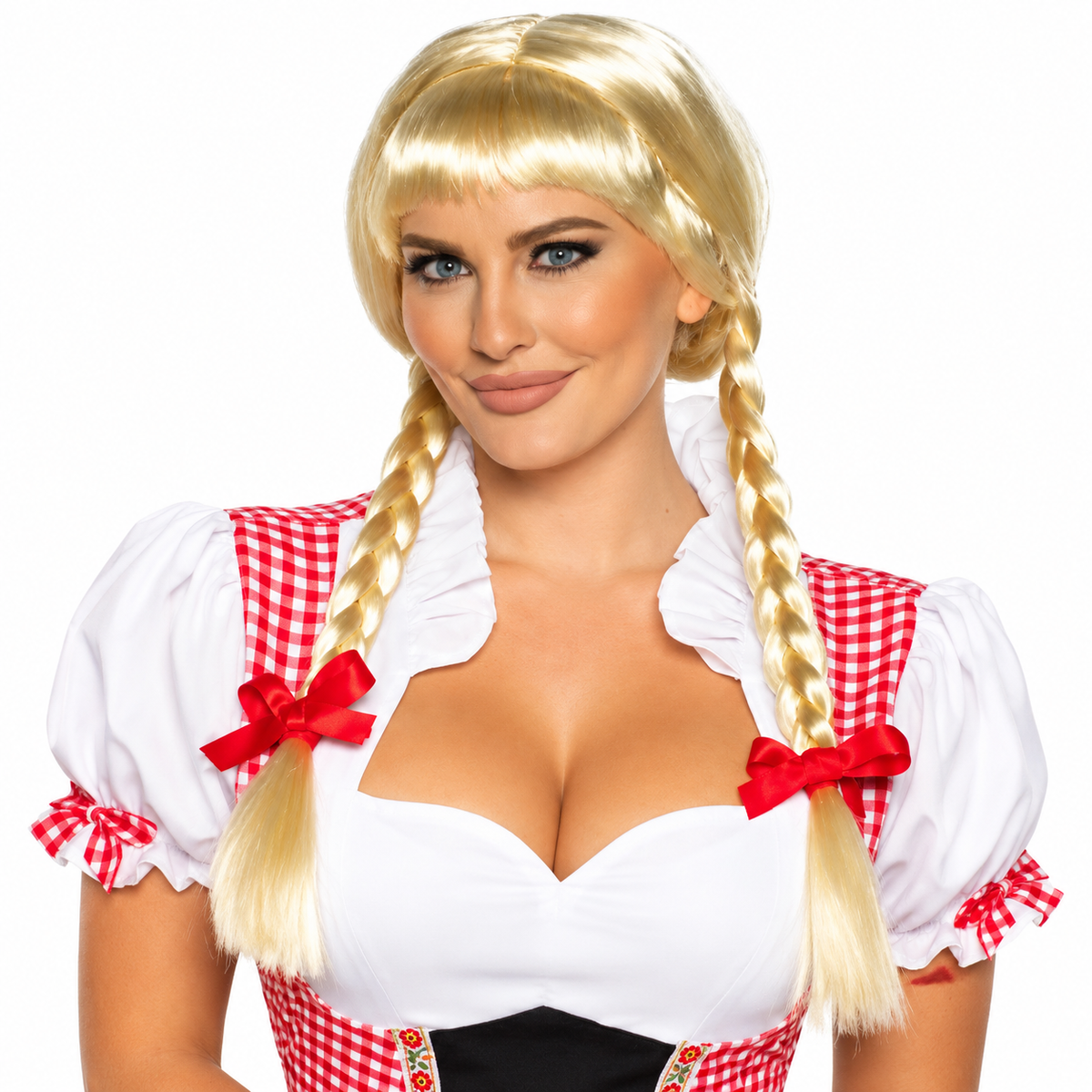 A woman modeling a blonde braided wig with straight bangs, styled in two long pigtails, paired with a white and red gingham dirndl costume against a plain white background.