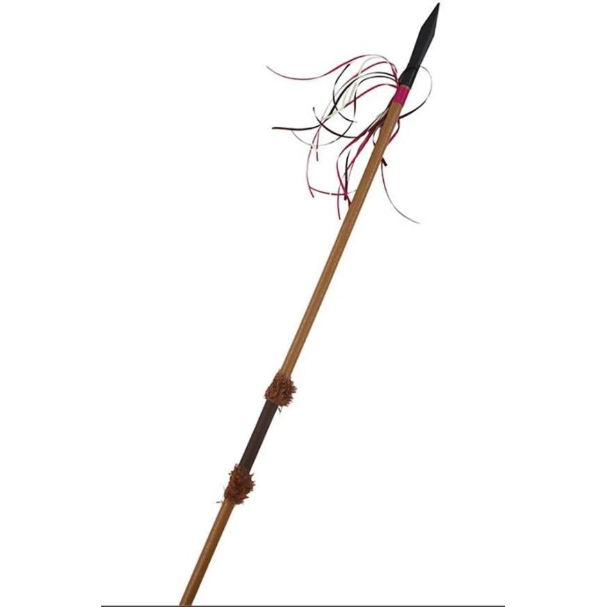 A traditional spear with a light brown wooden look shaft, a black rubber tip, and red, cream and brown ribbons , shown against a plain white background