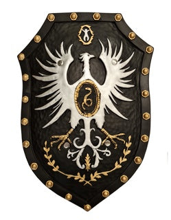 50cm leather-look knight shield in black with gold stud border detail, featuring a white heraldic eagle crest with gold medallion centre, gold laurel wreath, and decorative scrollwork, shown as a wall display prop