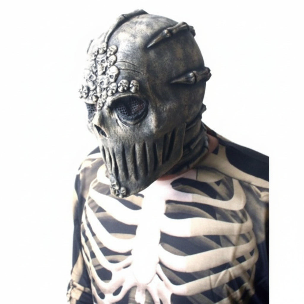 A person wearing a detailed zombie mask with a ribbed mouth and a bone-patterned shirt against a plain white background.