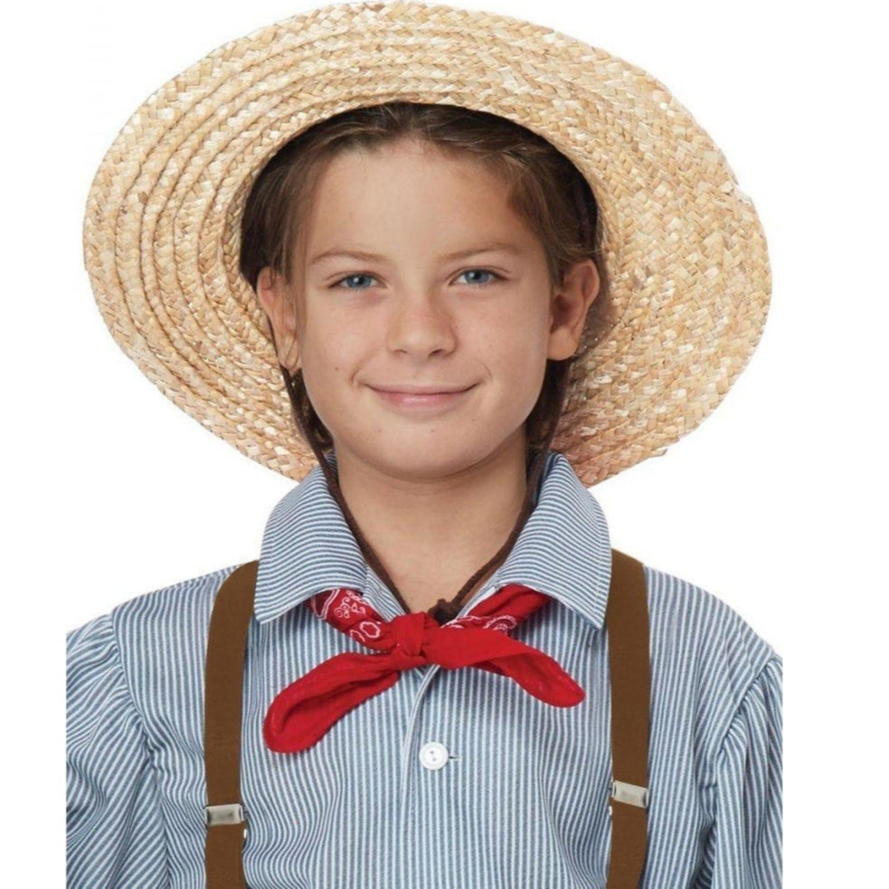 Child wearing a cute straw hat with a wide brim on a sunny day