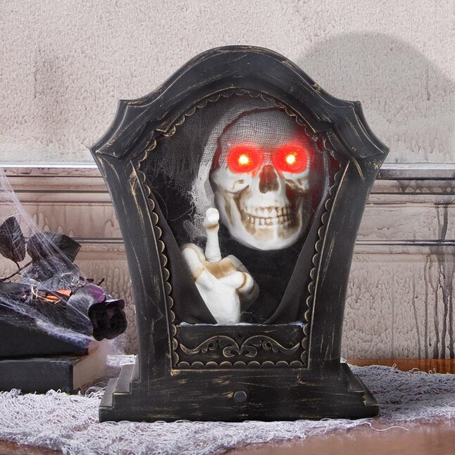 A spooky and fun Halloween decoration featuring a tombstone with a skeleton tapping his foot, perfect for adding a touch of creepy whimsy to your holiday decor
