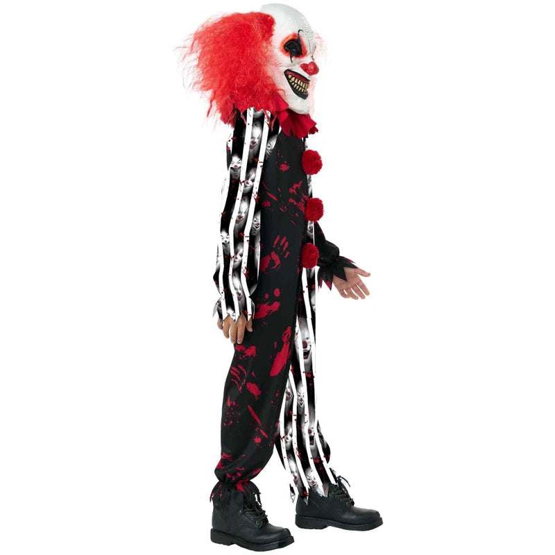 A child modeling a horror clown costume consisting of a black jumpsuit with red blood splatter and white vertical stripes, a white clown mask with red accents, and a bright red fluffy wig, shown against a plain white background.