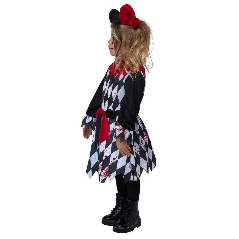 A child model shown in profile wearing a Minnie Mouse-inspired costume dress with a black and white harlequin pattern, red collar and sash, black mouse ears headband, and black boots, against a plain white background.