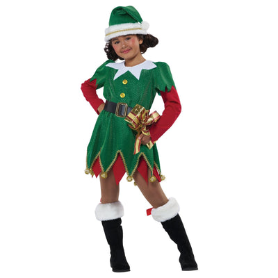Adorable child wearing a festive Christmas outfit and smiling with joy