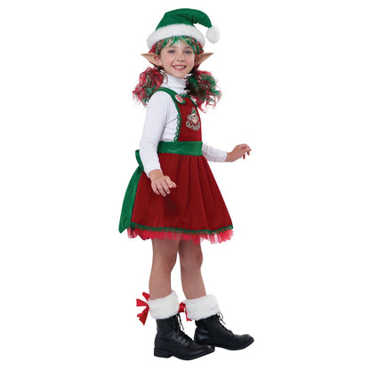 A smiling child dressed as an elf holds a candy cane