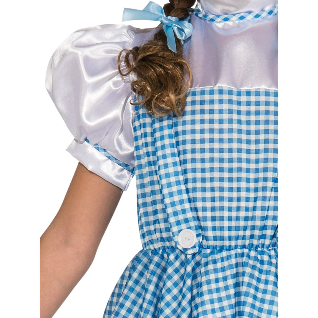  Dorothy costume for adults in size M featuring a blue dress with attached white blouse, puffy sleeves, and lace trim, perfect for Wizard of Oz themed events