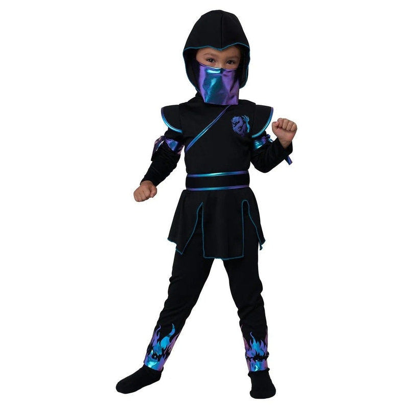 A child wearing a black ninja costume with blue and purple flame-like accents, a hood, and a matching face covering, standing against a plain white background.