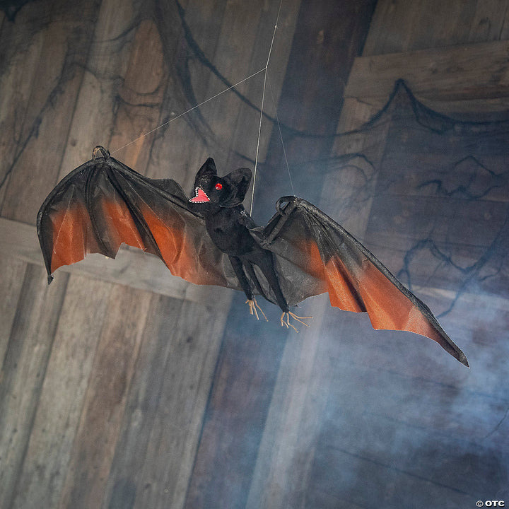 Large black and red hanging vampire bat decoration for Halloween party