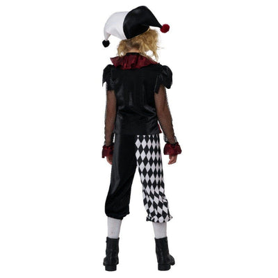 A child model shown from the back wearing a jester costume, featuring a black and white hat with red pom-poms, a black top with a red ruffled collar, black-and-white harlequin patterned pants, white tights, and black boots, set against a plain white background.