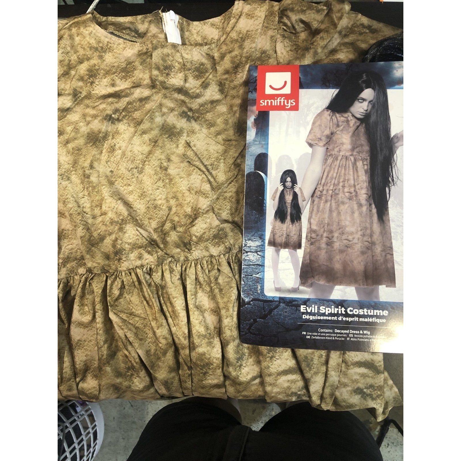 An eerie and sinister Evil Spirit Costume, featuring tattered robes and a haunting mask