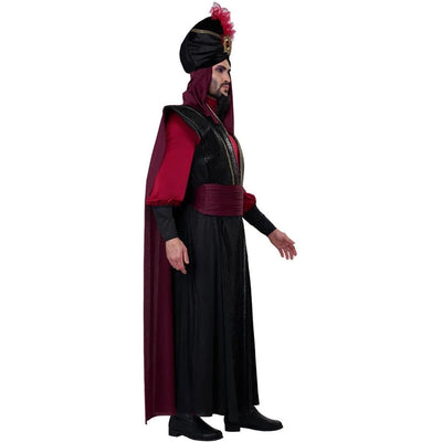 A man wearing a full-length black and deep red costume with a matching headpiece and small red feather detail, standing against a plain white background.
