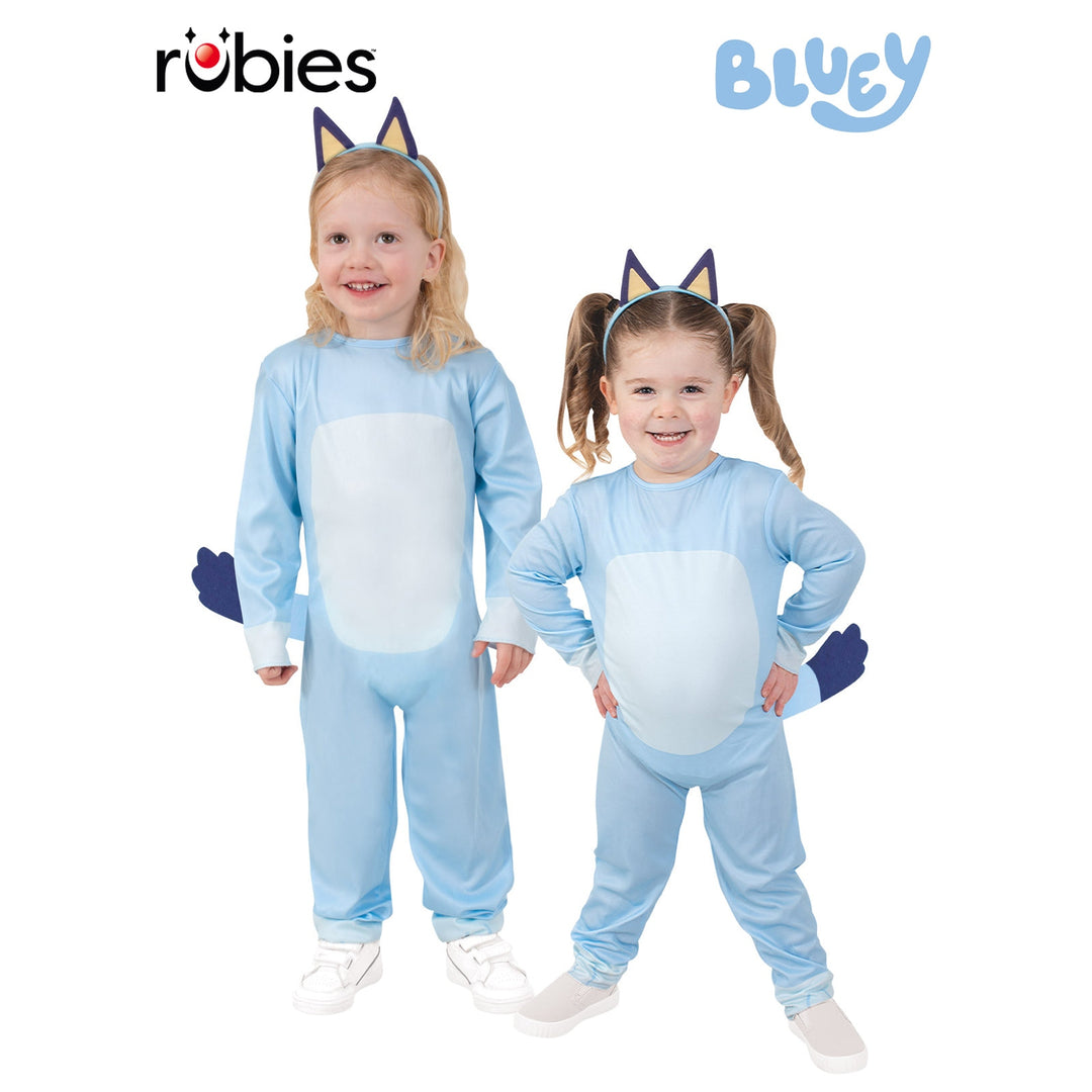 Adorable toddler wearing a Bluey costume with ears and tail