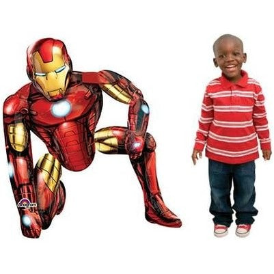 Giant Iron Man Airwalker foil balloon in action pose standing next to a child for size reference