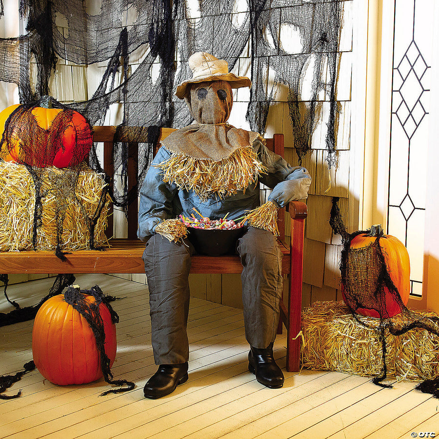 54 Animated Sitting Scarecrow with a hat and autumn-colored clothing