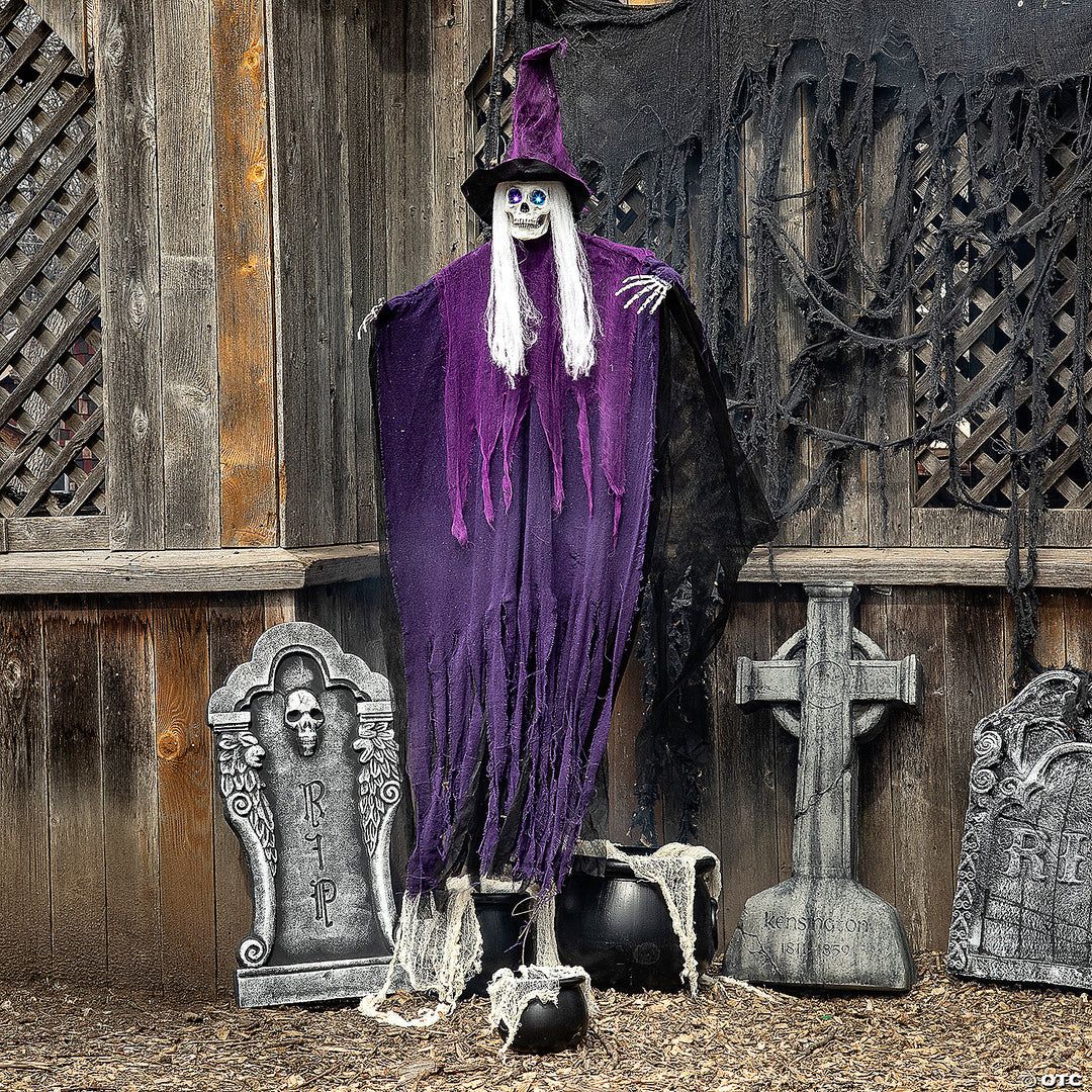 A spooky 6 Ft Hanging Light-Up Eyes Skeletal Witch with glowing eyes and eerie presence