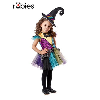 Child wearing a colorful witch costume with a hat on a white background, featuring the Rubies brand.