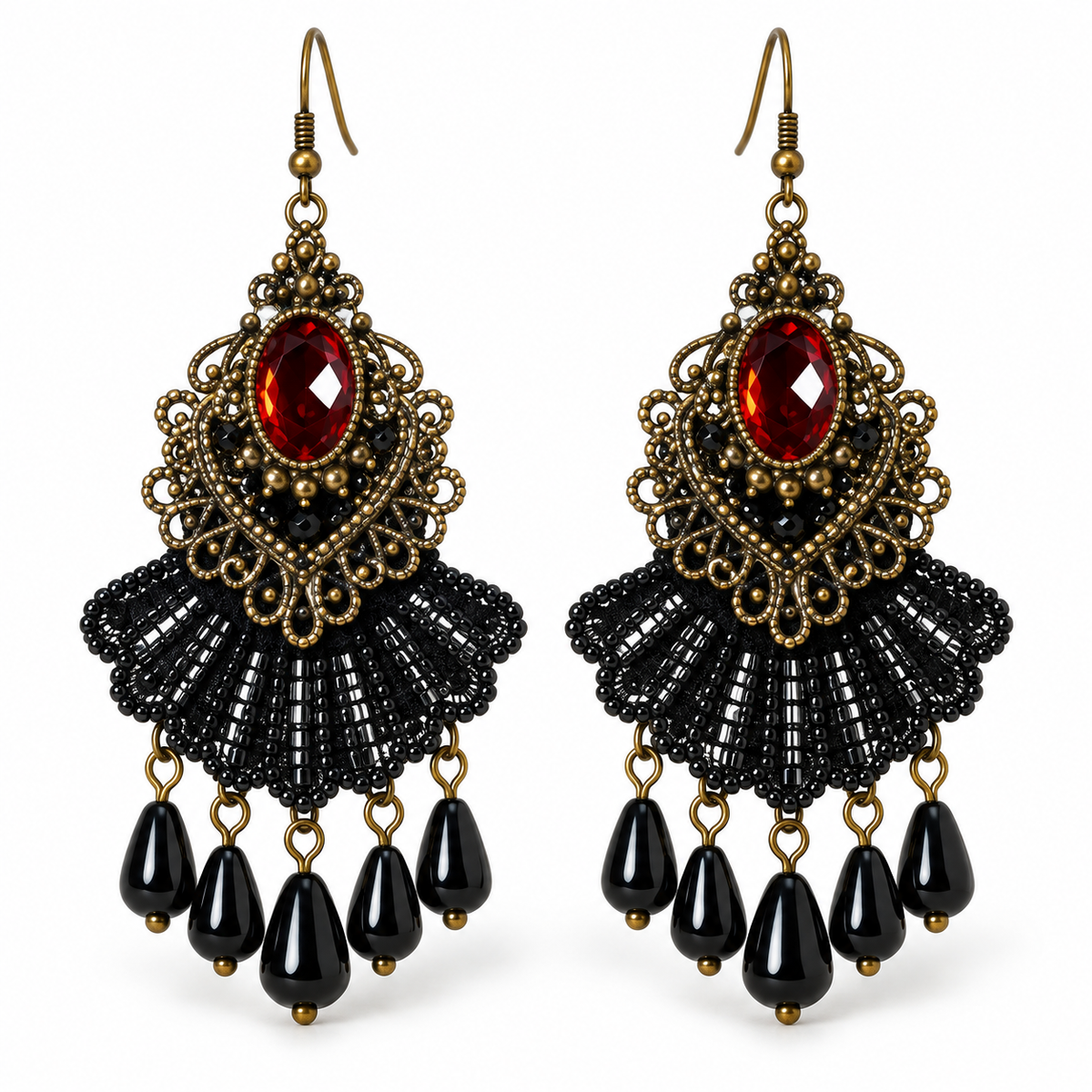 A pair of ornate drop earrings with antique gold filigree, a faceted red gemstone, a black beaded fan, and dangling black teardrop beads on a white background.