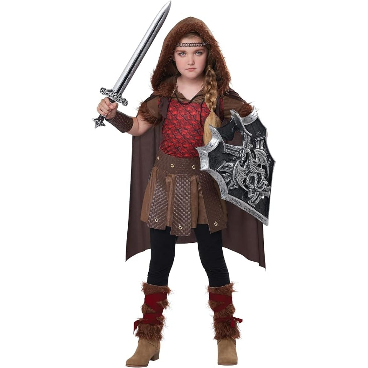 A child wearing a Viking warrior costume, holding a toy sword and shield, on a solid white background.
