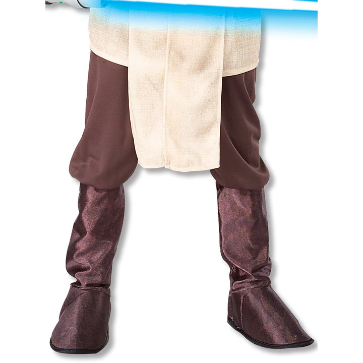 Star Wars themed child's costume with Jedi Knight design and accessories