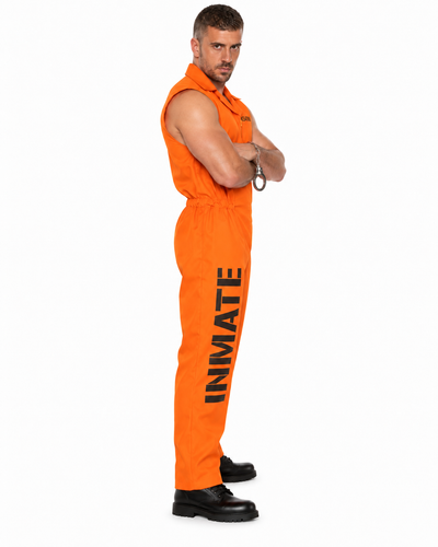 A man modeling an orange sleeveless inmate jumpsuit with 'INMATE' printed vertically in black on the leg, paired with black shoes, against a plain white background.