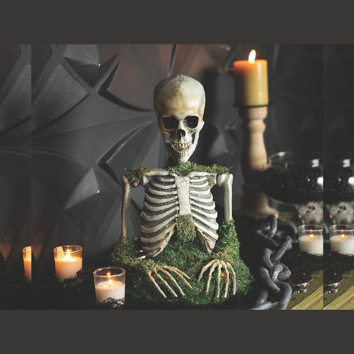 Handcrafted animated mossy skeleton tabletop with realistic moss and weathered bones