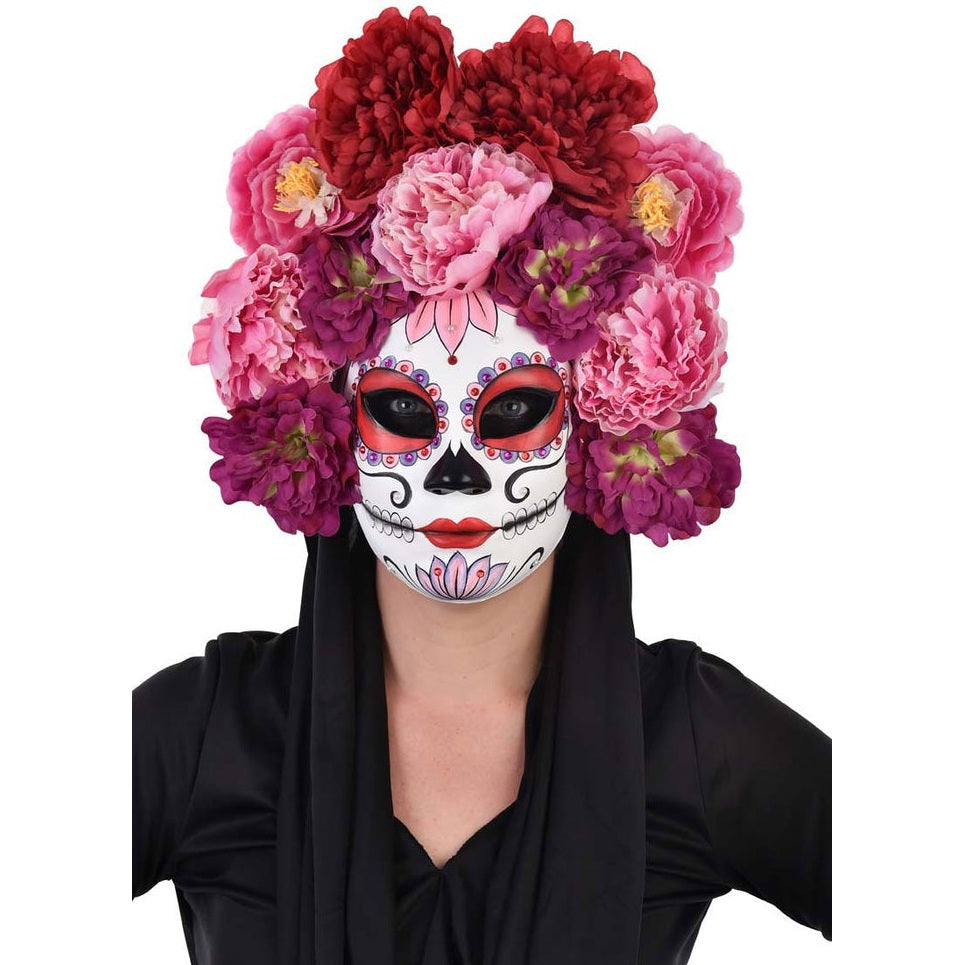 Handmade pink floral Day of the Dead mask with intricate details and vibrant colors
