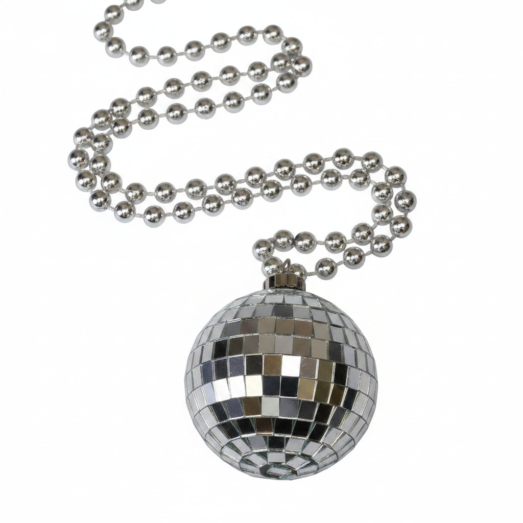 A silver disco ball necklace with a faceted mirror-like pendant on a black beaded chain, shown with its retail card packaging.