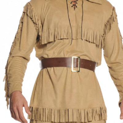 A man modeling a tan faux-suede fringed costume with a brown belt, brown boots, and a brown faux-fur hat against a plain white background.