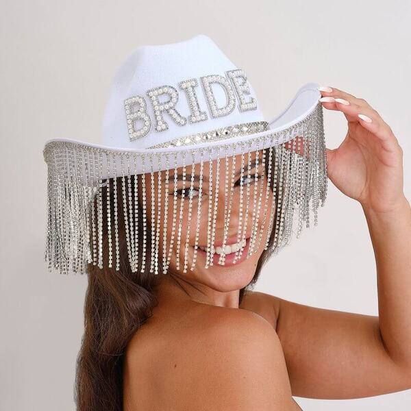 A beautiful white bride cowboy hat with lace and flower accents