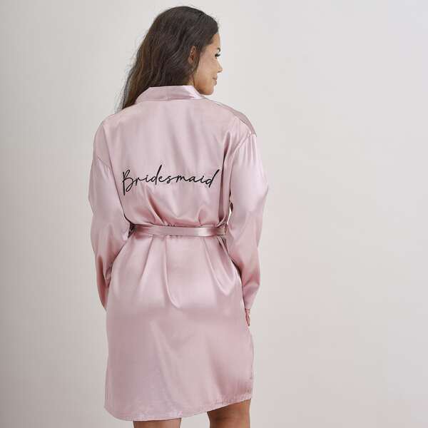 A photo of the Ginger Ray Bridesmaid Dressing Gown Robe in pink, perfect for a hens party celebration