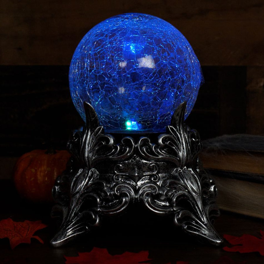 Shiny crystal ball with intricate designs and mystical symbols floating inside 