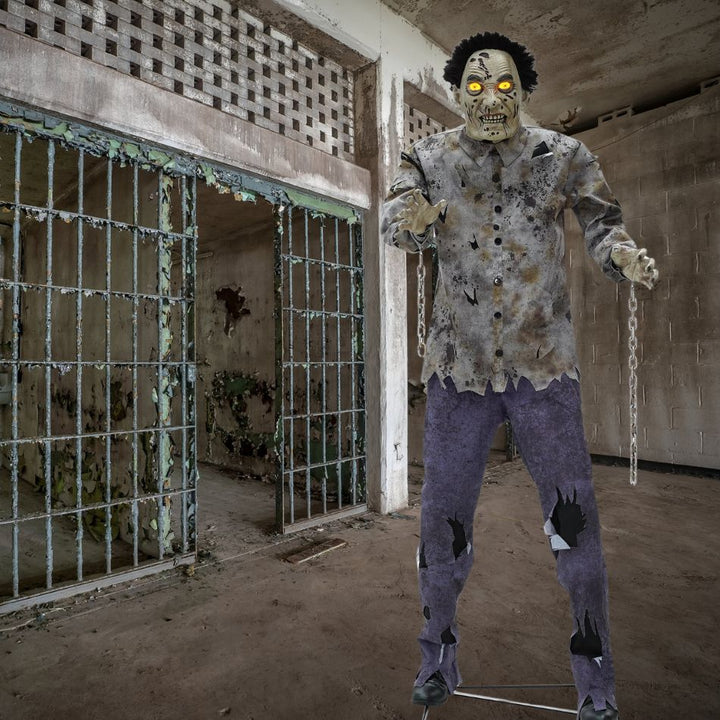 6-foot tall animatronic guard zombie with glowing eyes and moving limbs