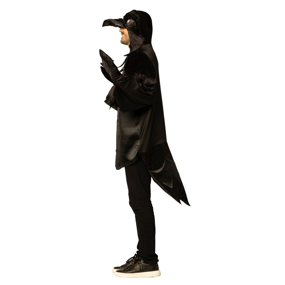 Person wearing a black plague doctor costume with a hood and gloves on a white background