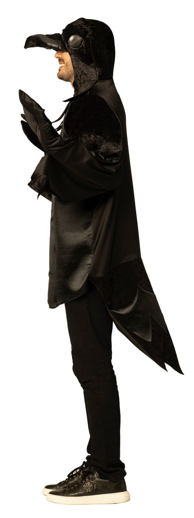 Person wearing a black plague doctor costume with a hood and gloves on a white background