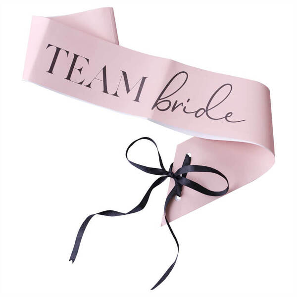 A group of colorful Team Bride paper sashes by Ginger Ray for a fun and stylish hen's night celebration