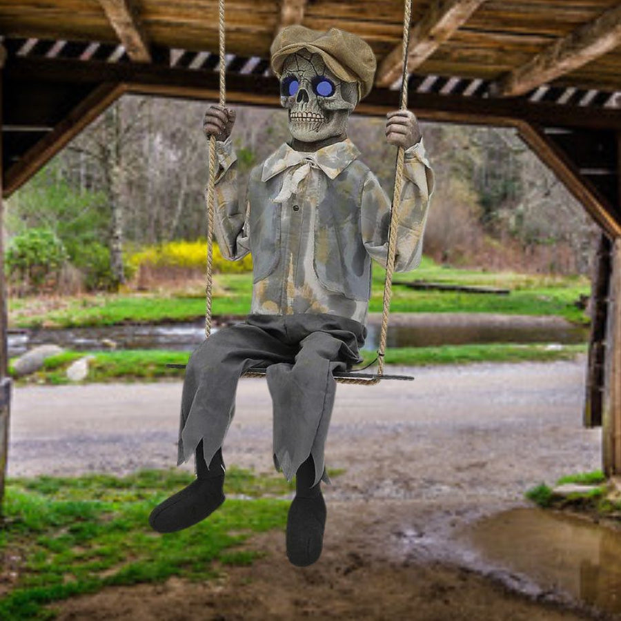 Swinging Skeletal Boy with glowing eyes and spooky skeletal costume