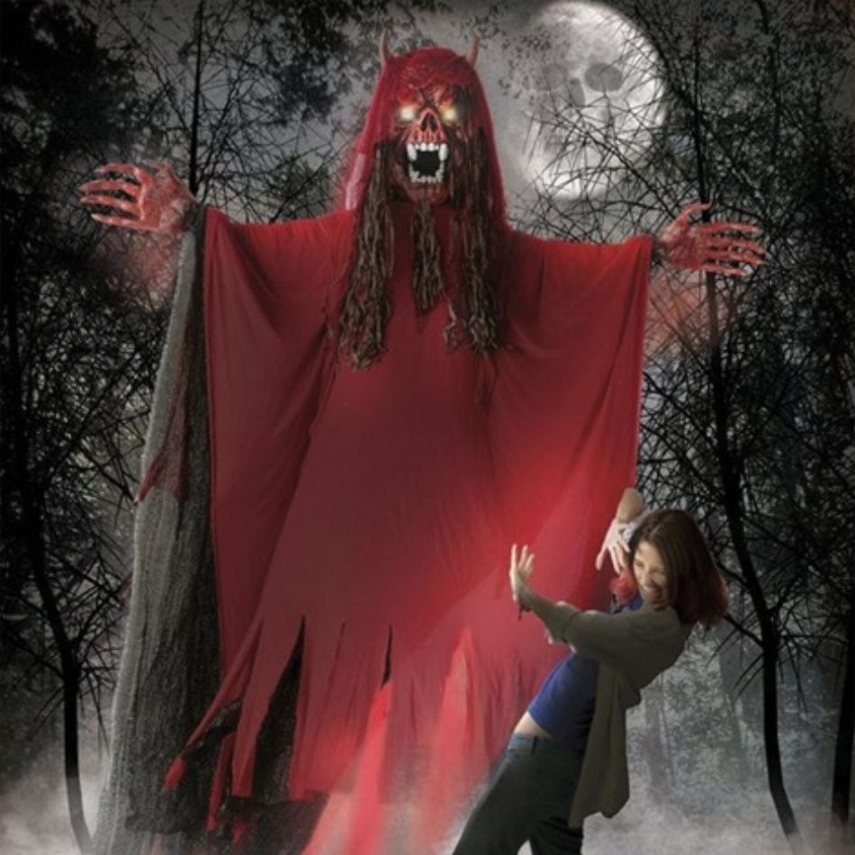 A scary and menacing 10' hanging red fanged demon Halloween decoration