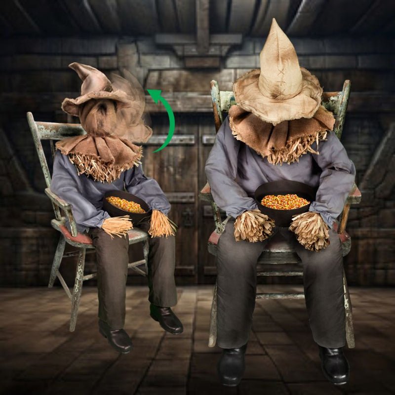 Sitting scarecrow with straw hat and plaid shirt in a pumpkin patch