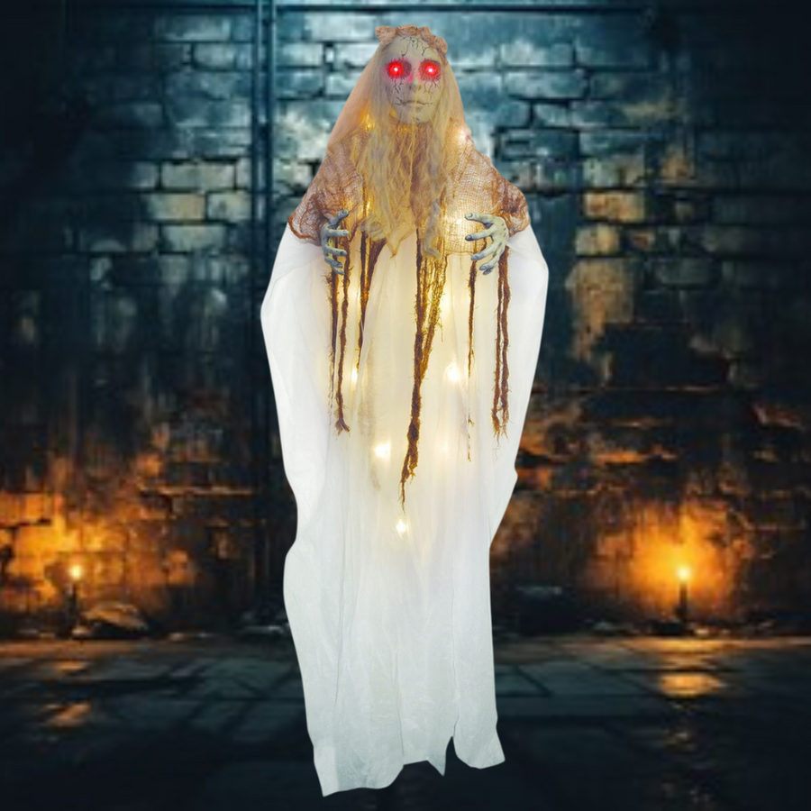 Alt text: Eerie and realistic illuminated creepy bride Halloween decoration with glowing eyes and tattered wedding dress