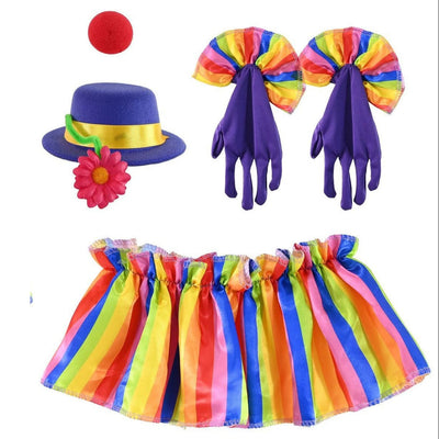 A clown costume set on a plain white background, including a purple hat with a yellow band and pink flower, a red ball, purple gloves with rainbow bow accents, and a rainbow striped skirt.