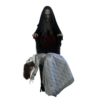 1.8m animated wicked witch animatronic in black hooded robe holding red apple, looming over possessed girl in white lace dress bent backwards