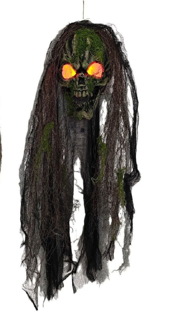 Hanging Halloween skull decorations with tattered dark fabric and glowing eyes, with orange eyes, shown on a plain white background