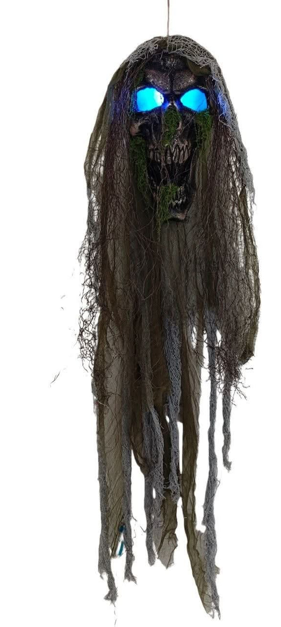 Hanging Halloween skull decorations with tattered dark fabric and glowing eyes,  with blue eyes a shown on a plain white background.