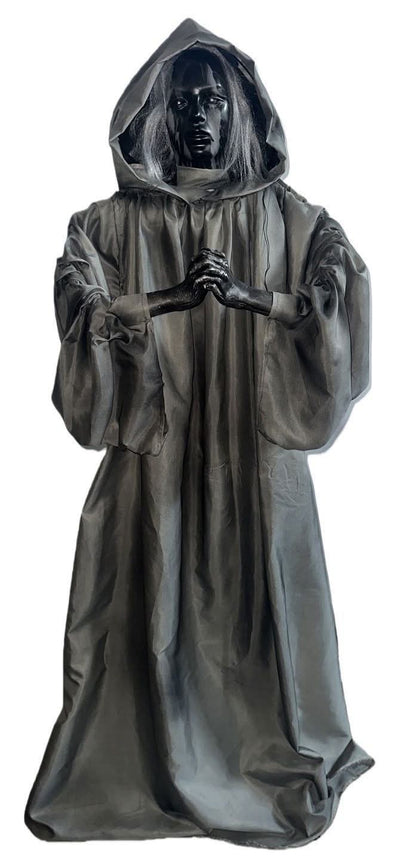  Halloween ghostly figurine on a plain white background:  dark hooded robe with a pale face and outstretched hands, and 