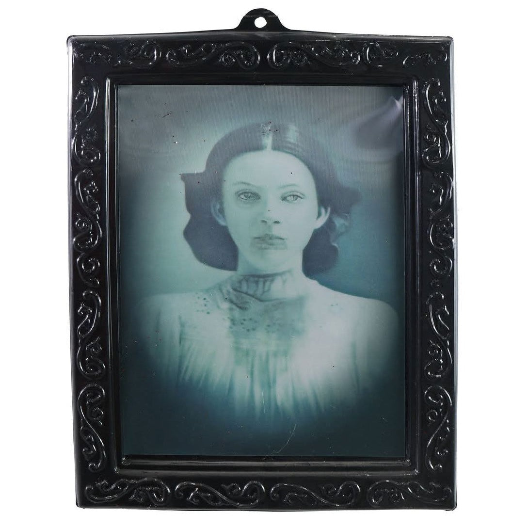 Two vintage-style portraits in ornate black frames on a white background