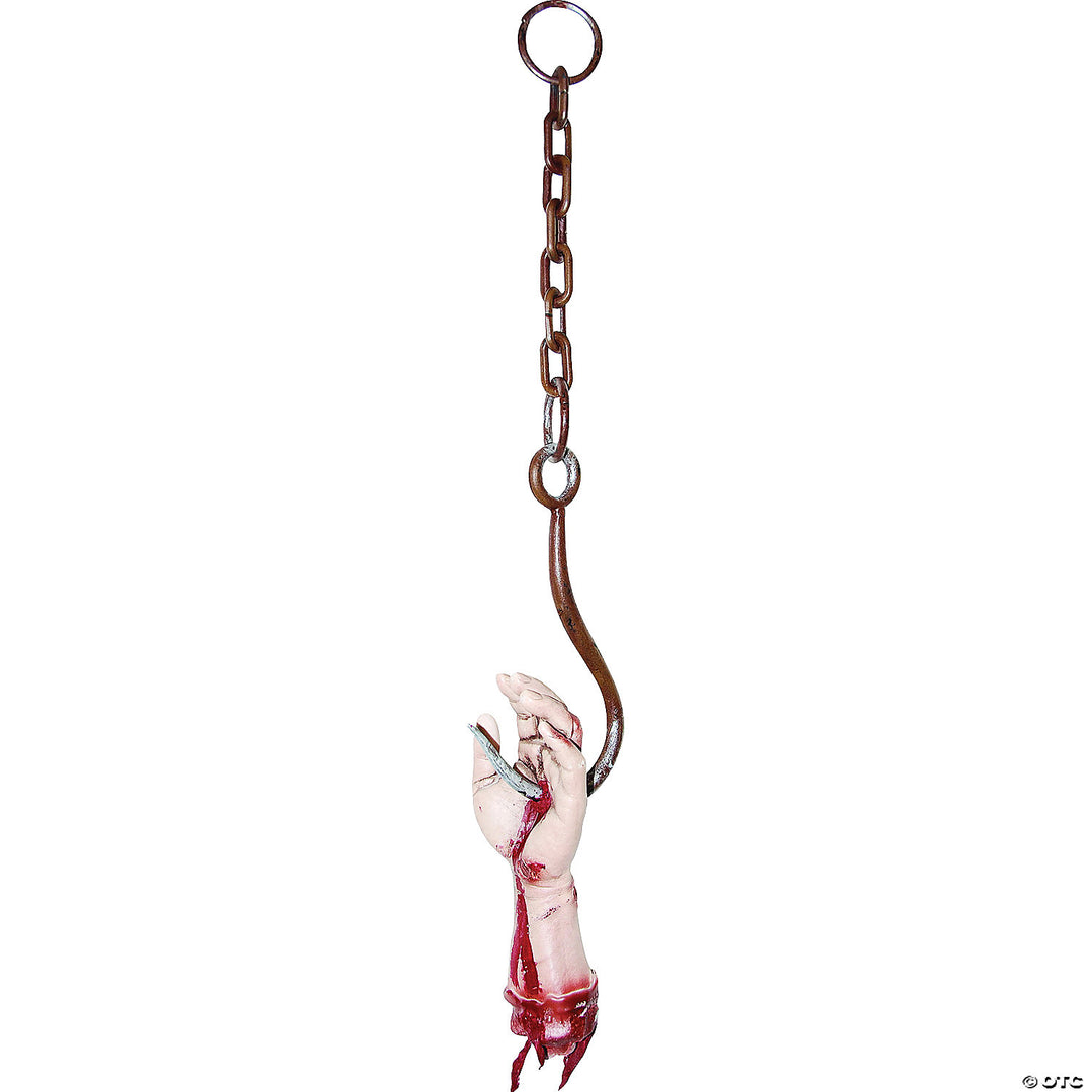 A spooky Halloween decoration of a hanging meat hook with a realistic severed zombie hand